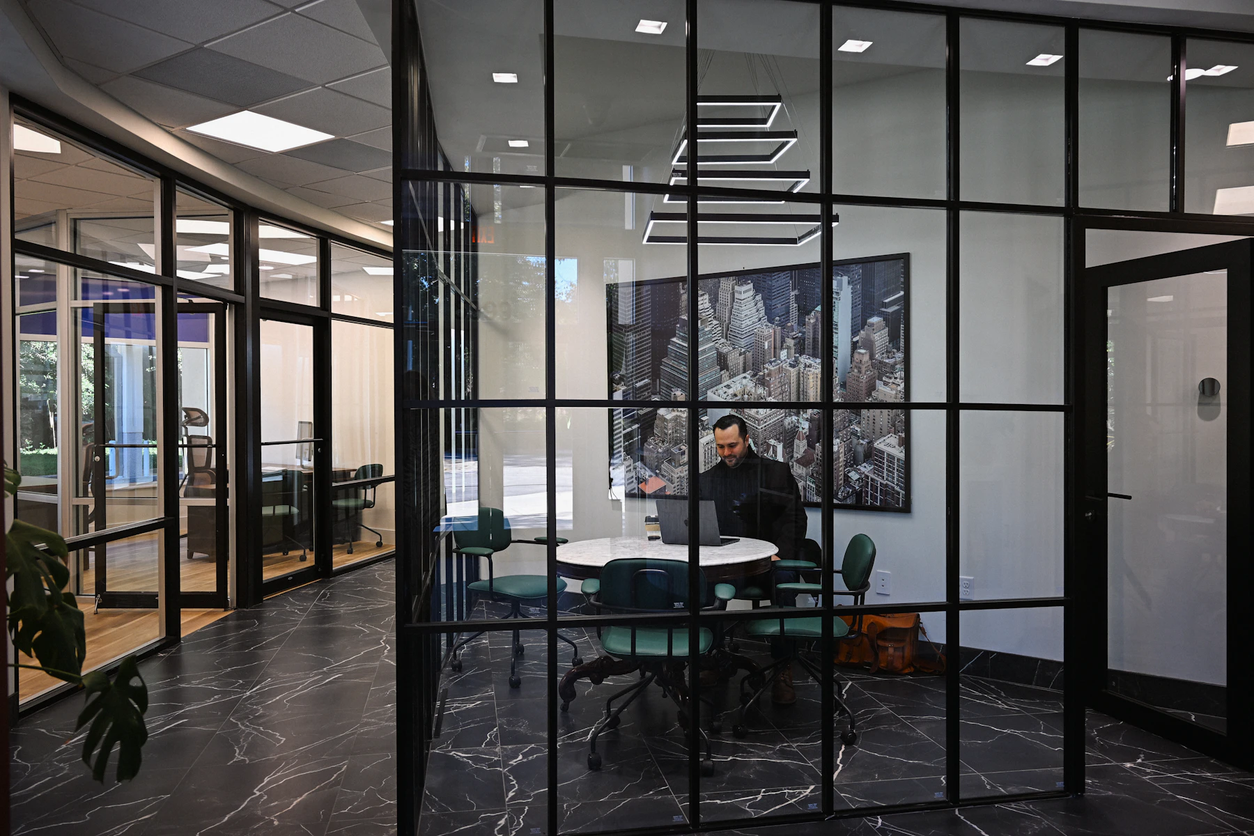 Business professional working with technology in a contemporary office, used as illustrative imagery